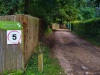 2.2 km The tarmac ends, and Withymead is on the left side of the bridleway.