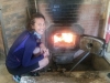 Rachel warming up by a pizza oven in Avignonet-Lauragais